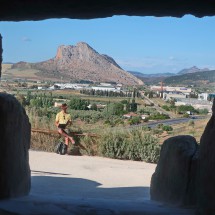 View from Dolmen de Menga to the holy mountain Peña de Los Enamorado which looks like the face a man lying down